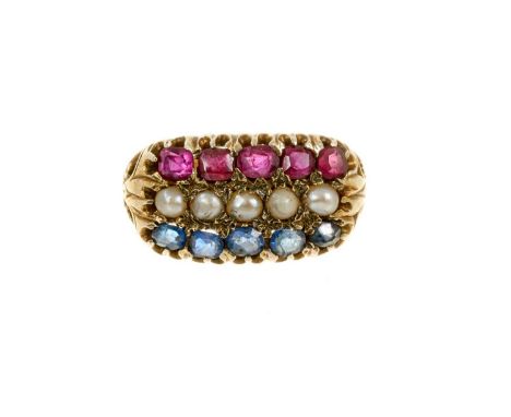 Victorian ruby, sapphire and pearl triple row ring in claw setting, pierced scroll shoulders on tapered shank, ring size N.