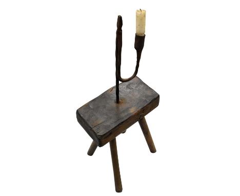 19th century rush light, raised on substantial plinth and splayed supports, 70cm high