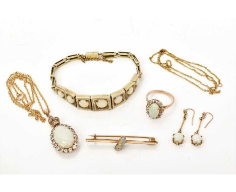 A group of antique opal jewellery to include an opal and synthetic white stone pendant and ring, an opal bracelet, brooch and