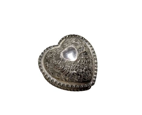 Late 19th/early 20th century American silver trinket box in the form of a heart, with embossed floral and foliate decoration,