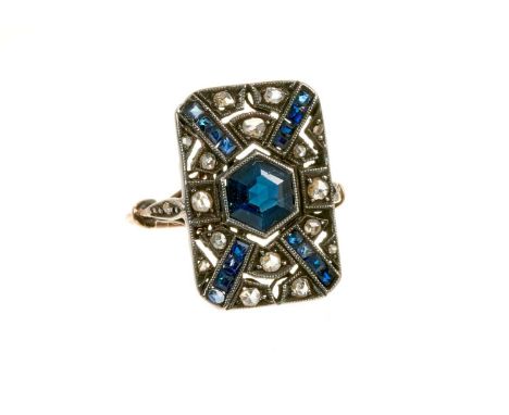 Art Deco sapphire and diamond cocktail ring with a rectangular openwork plaque centred with a hexagonal cut blue sapphire, ca