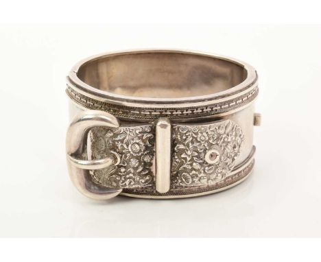 Victorian silver cuff bangle with belt and buckle design and floral decoration, 39mm wide.Good condition commensurate with ag