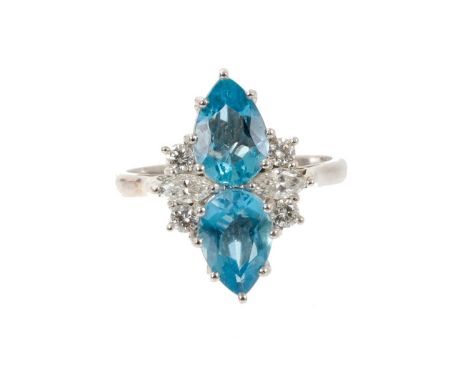 Aquamarine and diamond cocktail ring with two pear-cut aquamarines flanked by marquise cut and brilliant cut diamonds to the 