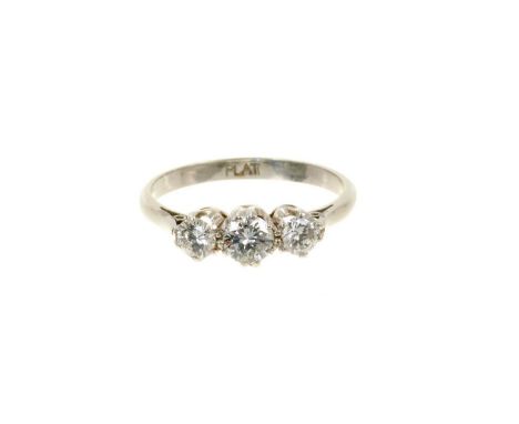 Diamond three stone ring with three brilliant cut diamonds in claw setting on platinum shank, estimated total diamond weight 