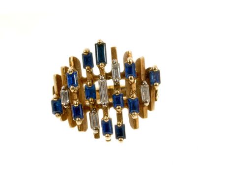 1960s/1970s gold sapphire and diamond cocktail ring of abstract design set with twelve baguette cut sapphires and five baguet