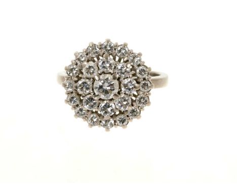 Diamond cluster ring with a flower head cluster of brilliant cut diamonds estimated to weigh approximately 1.2cts, in tiered 