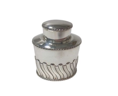 George V silver tea caddy of oval form with wrythen decoration, gadrooned borders and slip on cover (Sheffield 1912) Atkin Br