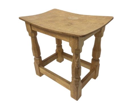 Robert ‘Mouseman’ Thompson oak stool, with bowed seat on facetted supports, one leg with signature mouse, 40cm wide