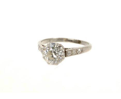 Diamond single stone ring with an old cut diamond estimated to weigh approximately 1.85cts in claw setting flanked by diamond