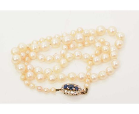Cultured pearl necklace with a string of graduated cultured pearls measuring approximately 3.5mm -7.75mm on an antique sapphi