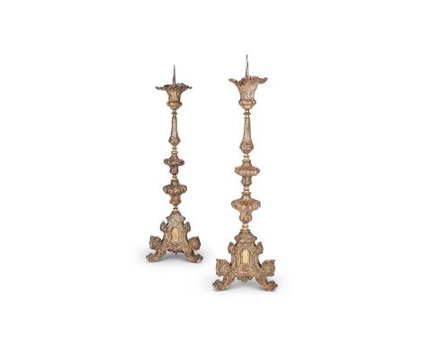 A pair of tall 19th century Renaissance Revival pressed metal pricket candlesticks
On triform bases with scrolled feet, each 