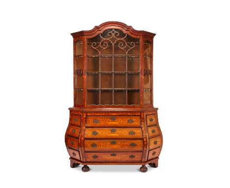 A late 18th / early 19th century Dutch marquetry bombé china cabinet on commode
The undulating cornice above a wide scrolling