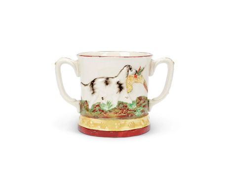 A 19th century Staffordshire twin handled 'hidden frog' cup, &nbsp;and a 19th century Staffordshire Toby Jug
The mug decorate