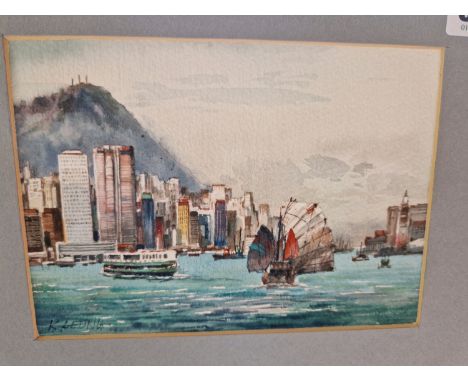 K LEUNG (CONTEMPORARY), A JUNK SAILING IN HONG KONG HARBOUR, WATERCOLOUR, SIGNED LOWER LEFT.   12.5 x 17cms.