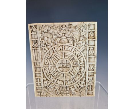 A TIBETAN ELEPHANT TOOTH PANEL CARVED WITH AN ASTROLOGICAL CALENDAR OR KALACHAKRA, THE WHEEL CARVED WITH THE TWELVE ANIMALS R