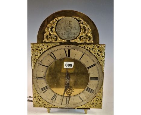 A LANTER / SHELF CLOCK, THE PENDULUM MOVEMENT COUNTWHEEL STRIKING ON A BELL, A SILVERED ROUNDEL IN THE ARCH OF THE BRASS FACE