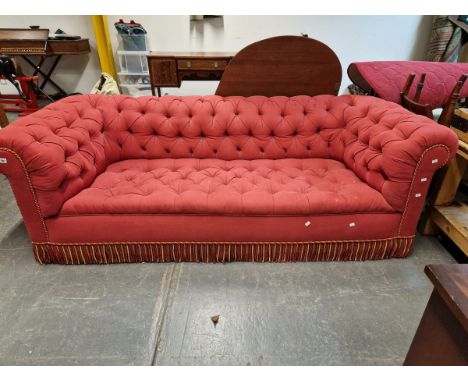 A VINTAGE CHESTERFIELD BUTTON UPHOLSTERED IN RED.   W 241 x D 95 x H 78cms.