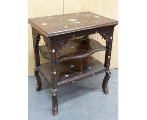 AN ISLAMIC MAHOGANY THREE TIER TABLE, EACH BLIND FRET CARVED WITH FOLIAGE BANDS ABOUT MOTHER OF PEARL INLAID STARS, THE STARS