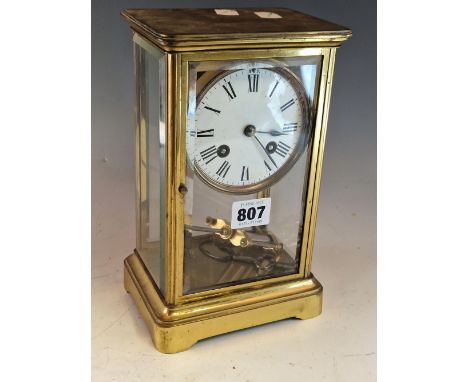 A BEVEL GLAZED BRASS CASES CLOCK BY RICHARD ET CIE, THE MERCURY COMPENSATED PENDULUM MOVEMENT STRIKING ON A BELL.   H 23cms.