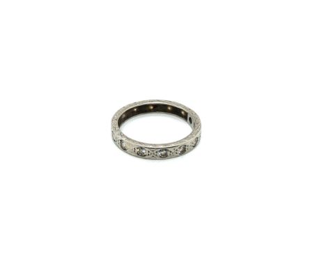 A VINTAGE FULL ETERNITY STYLE DIAMOND SET BAND. UNHALLMARKED, ASSESSED AS PLATINUM. FINGER SIZE N. WEIGHT 2.62grms.