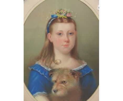 VICTORIAN SCHOOL, OVAL PORTRAIT OF A GIRL CUDDLING HER TERRIER TO HER BLUE DRESS, PASTEL.   61 x 45cms.
