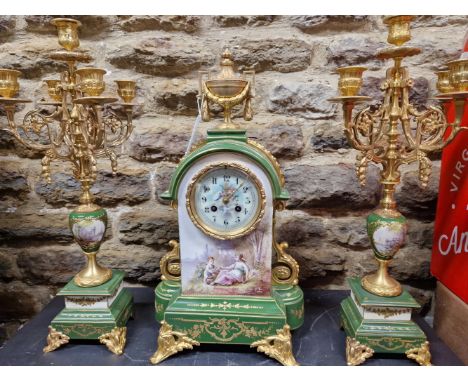 A LATE 19th/EARLY 20th C. FRENCH APPLE GREEN AND GILT PORCELAIN CLOCK GARNITURE, THE CLOCK WITH COUNTWHEEL STRIKE, CUPID AND 