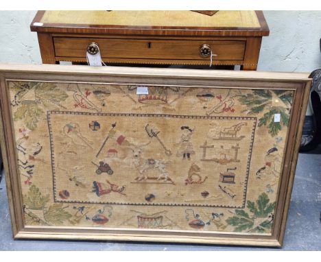 A WOOL WORK SAMPLER SEWN WITH A CENTRAL GOAT SURROUNDED BY TOYS , FIGURES AND IMPLEMENTS WITHIN A COMB EDGED FRAME DRUMS, BUG