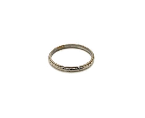 A VINTAGE WEDDING BAND RING. STAMPED PLATINUM, ASSESSED AS PLATINUM. FINGER SIZE P. WEIGHT 2.48grms.