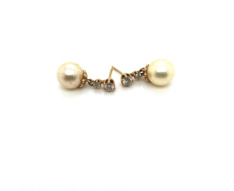 A PAIR OF CULTURED PEARL AND GRADUATED DOUBLE DIAMOND DROP EARRINGS. THE CULTURED PEARL APPROX 8.2mm. THE DIAMONDS 3.7mm AND 