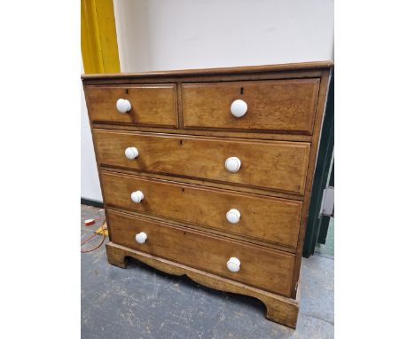A VICTORIAN MAHOGANY CHEST OF TWO SHORT AND THREE LONG DRAWERS EACH WITH WHITE CERAMIC KNOB HANDLES ABOVE BRACKET FEET.   W 1