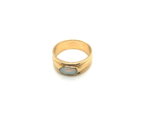 A 9ct HALLMARKED GOLD AND OPAL BAND RING. FINGER SIZE V. WEIGHT 7.60grms