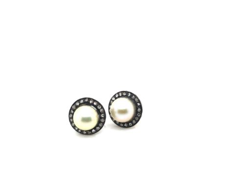 A PAIR OF VINTAGE CULTURED PEARL AND DIAMOND STUD EARRINGS. THE EARRINGS UNHALLMARKED, ASSESSED AS SILVER MOUNTS WITH BASE ME