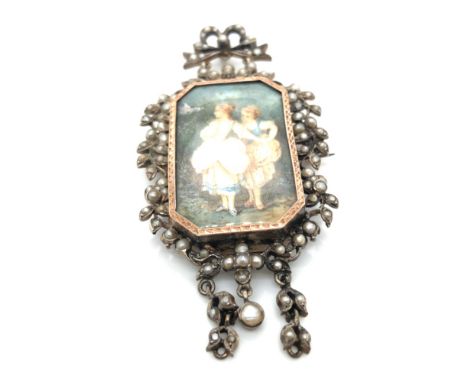 A 19th CENTURY SEED PEARL AND SILVER GILT PENDANT BROOCH, THE CENTRAL FINELY PAINTED MINIATURE DEPICTING TWO YOUNG MAIDENS WI