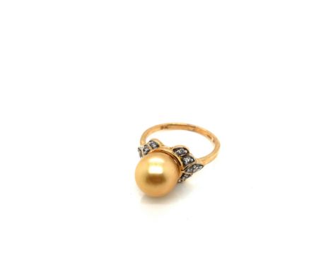 A HALLMARKED 9ct GOLD GOLDEN SOUTH SEA PEARL AND WHITE ZIRCON DRESS RING. PEARL APPROX 9mm. FINGER SIZE L 1/2. WEIGHT 3.79grm