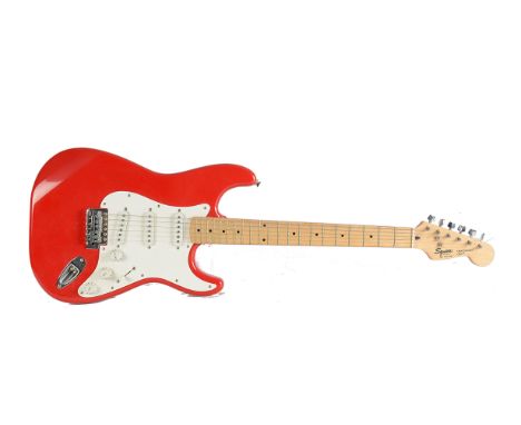 Electric Guitar, A Squier by Fender Stratocaster serial number CN429387 finished in red, made in Korea in very good condition