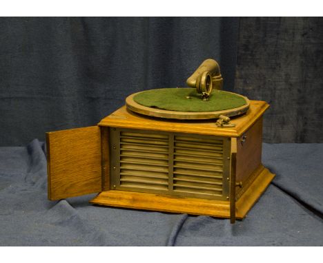 Hornless gramophone: a Cinch hornless, early model with metal grille, now with Gramophone  Co. Exhibition soundbox (no winder