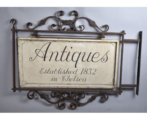 A Vintage Wrought Iron Framed Wall Mounting Shop Sign with Painted Wooden Board, "Antiques, Established 1832 in Chelsea", Ful