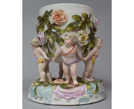 A Continental Porcelain Lamp Stand Decorated with Rose Bocage and Supported by Four Cherubs, Printed Mark to Base, 13cm Diame
