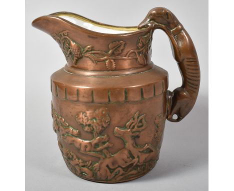 A Copper Lustre Jug Decorated in Relief with Hunting Scenes and Having Greyhound Handle, 14cm high 