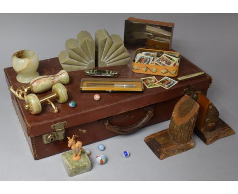 A Vintage Leather Suitcase Containing Art Deco and Other Bookends, Penknives etc 