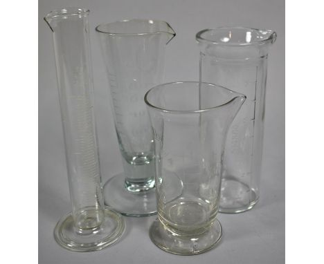 A Collection of Four Vintage Chemists Glass Measures 