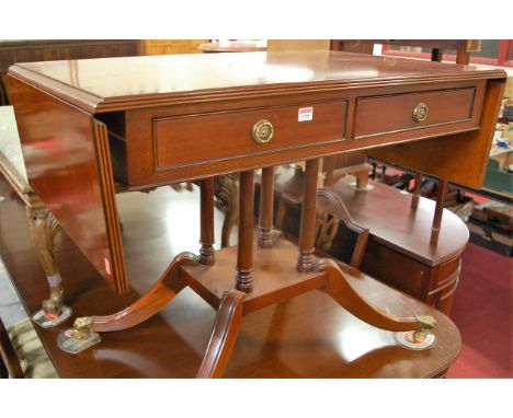 A reproduction mahogany dropflap two drawer sofa table, raised on outswept supports, w.98.5cm (leaves down)