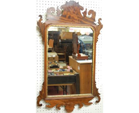 A 19th century Chippendale style mahogany fret carved wall mirror, having gilt inner detail, 77 x 45cm