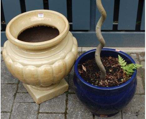 A contemporary glazed stoneware half-reeded circular pedestal planter; together with a blue glazed planter (2)