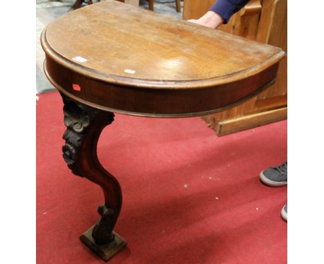 A 19th century Continental mahogany demi-lune console table, w.66cm