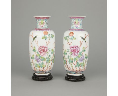 Pair of Chinese Republic period famille rose porcelain vases depicting flowers and birds, ca. 1890-1914. There are bands of a