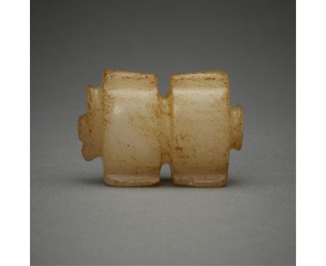 Chinese carved jade bead, possibly shaped like a cong. Of a pale yellow color with russet inclusions throughout.Included in t