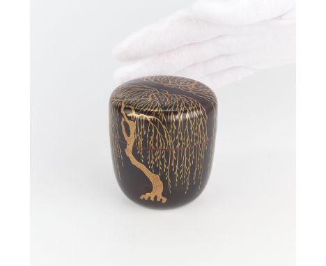 Japanese lacquerware natsume tea caddy, black and gold over a red ground. Edo period, ca. 18th to 19th century. The sides dec