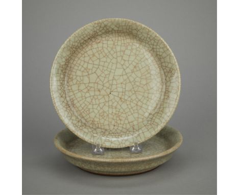 Pair of antique Chinese porcelain dishes with a celadon crackle glaze.(Each) height: 1 1/2 in x diameter: 7 3/4 in.Condition: