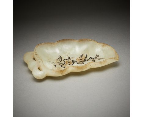 Chinese carved jade brush washer in the form of a leaf or bean pod. Carved floral decoration with black pigment along the int